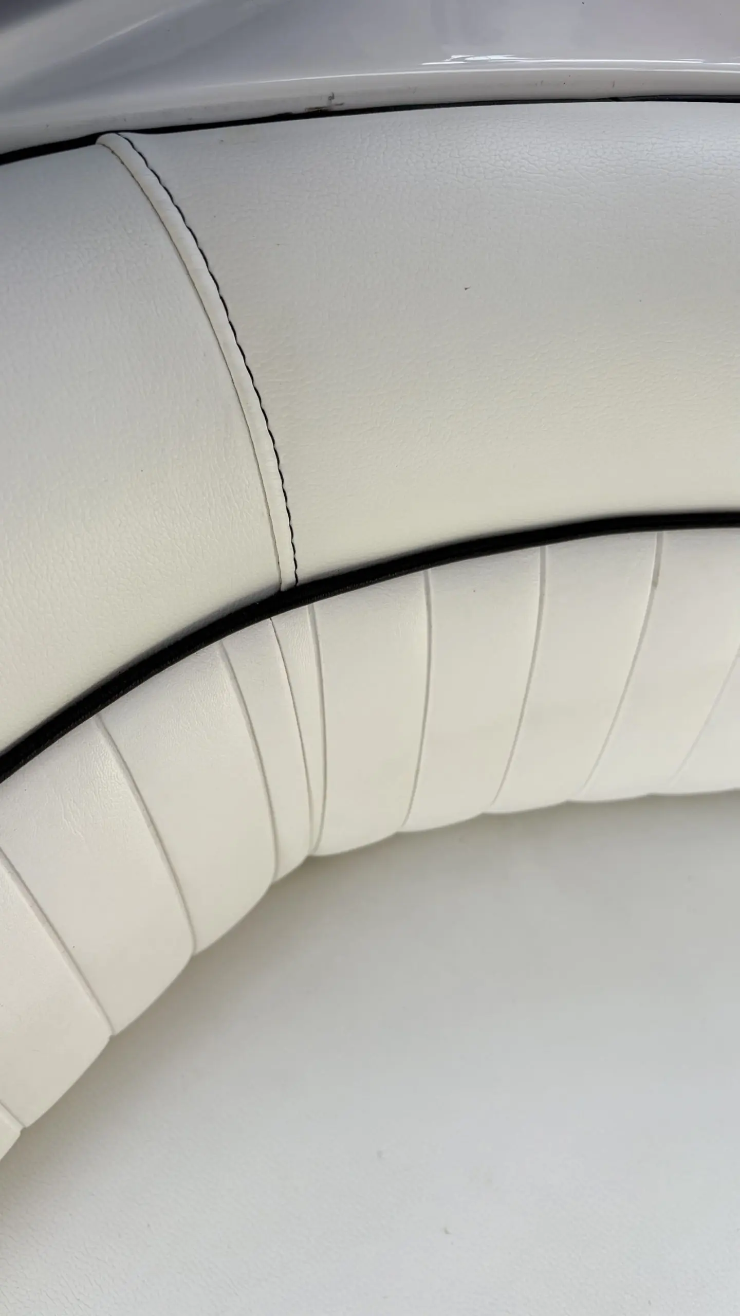 Cream upholstery on a boat cleaned and spot treated during an interior detail