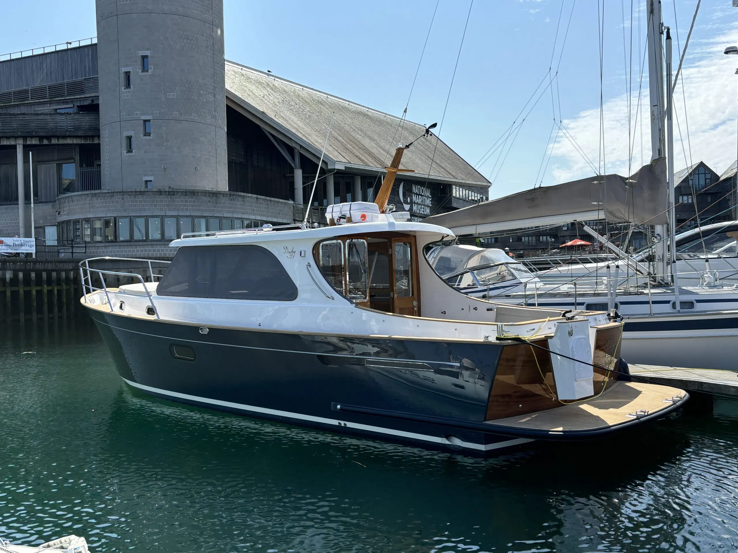 Motor launch alongside a Sydney wharf