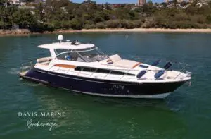 Chris-Craft Roamer 40 starboard side showing walkaround decks and foredeck sunbed