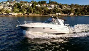 Monterey 330 Sport Yacht — cabin with cherrywood cabinetry and galley