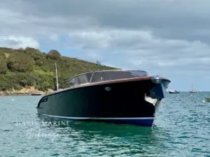 Grace tender cockpit with mahogany tables and tan Silvertex cushions