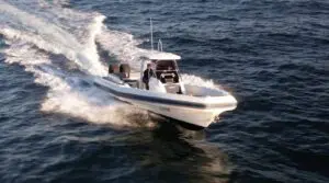 Mar.Co 35 R-Evolution running bow-on, showing the elevated bow and T-top