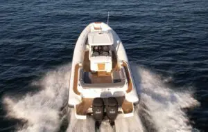 Aerial stern view of the Mar.Co 35 R-Evolution underway with twin Mercury 350hp outboards and teak aft deck