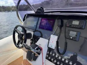 Helm of the Mar.Co 35 R-Evolution with twin Garmin chartplotter screens, VHF radio and wheel