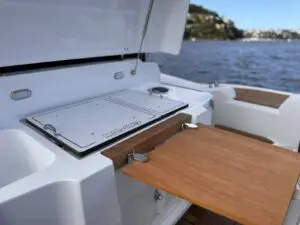 Driver bench galley with fridge hatch and teak table on the Mar.Co 35 R-Evolution