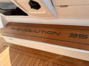 R-Evolution 35 badge inlaid in the teak step