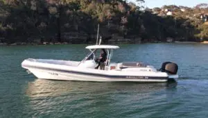 Mar.Co 35 R-Evolution at anchor beside sandstone cliffs on Sydney Harbour
