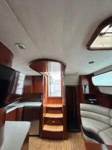 Saloon of the Chris-Craft Roamer 43 looking forward to the master cabin with wall-mounted TV