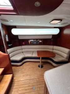 Curved saloon settee and table aboard the Chris-Craft Roamer 43 Heritage Edition
