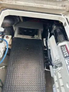 Engine room access on the Chris-Craft Roamer 43 showing a Volvo Penta engine and walkway