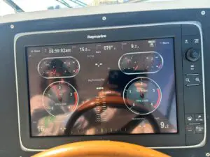 Helm dash of the Chris-Craft Roamer 43 with Raymarine display and engine gauges