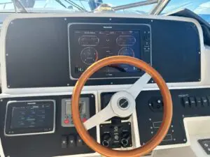 Helm dash and timber wheel of the Chris-Craft Roamer 43 Heritage Edition