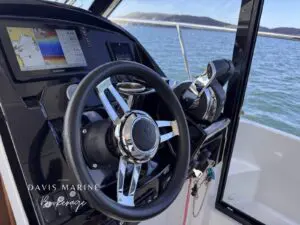 2020 Jeanneau Merry Fisher 895 helm wheel and Garmin chartplotter