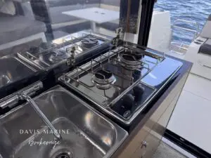 2020 Jeanneau Merry Fisher 895 galley with twin gas hob and sink