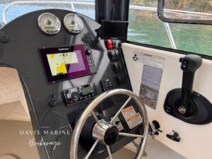 Arvor 675 Sportsfish helm dash with Garmin chartplotter, gauges and wheel