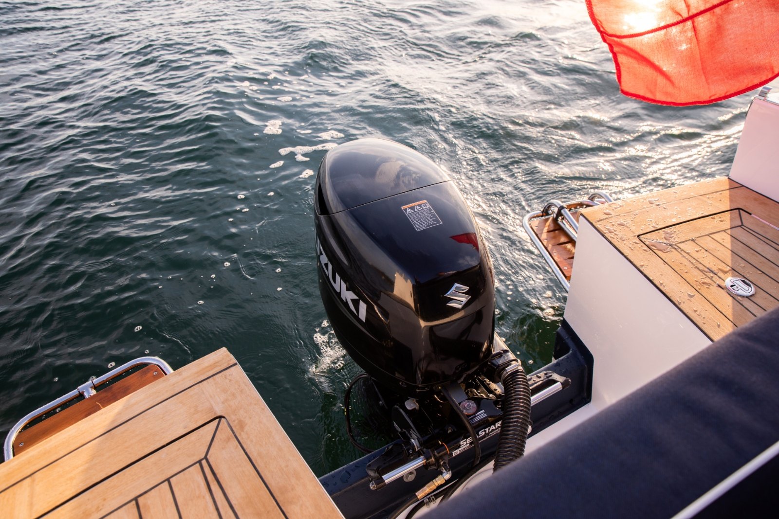 Outboard engine mounted on the transom of the Cockwells Duchy 25, between the two bathing platforms