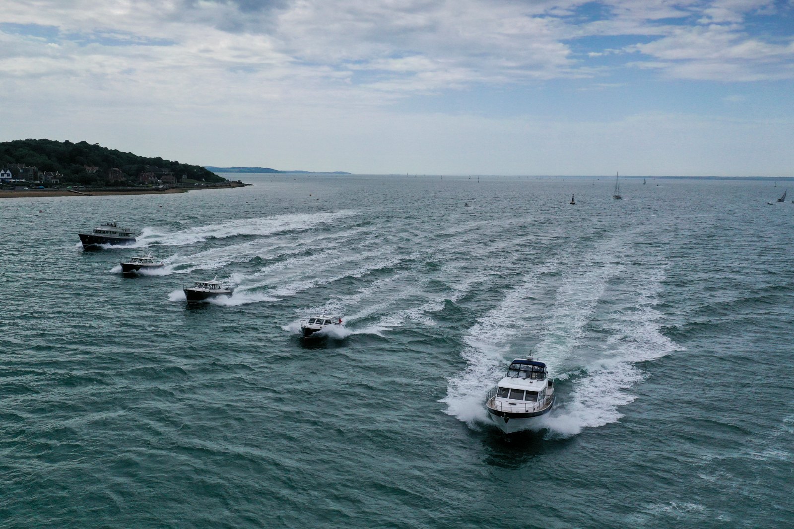 Drone photograph of the Cockwells fleet of Duchy and Hardy motor yachts in formation on the Solent, Owners' Rally 2025