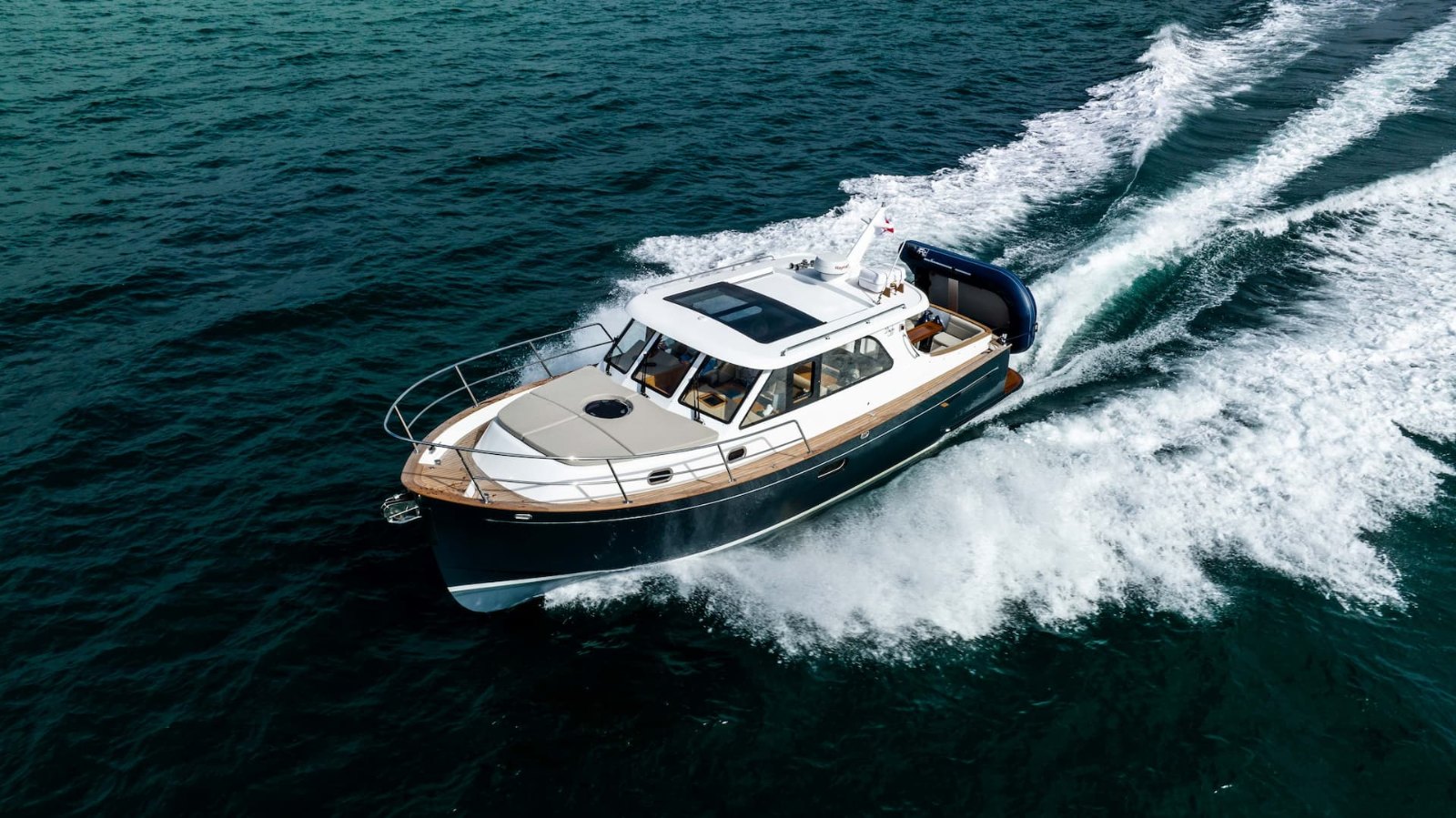 Duchy 35 'Betty' with dark grey hull running at speed, photographed from above