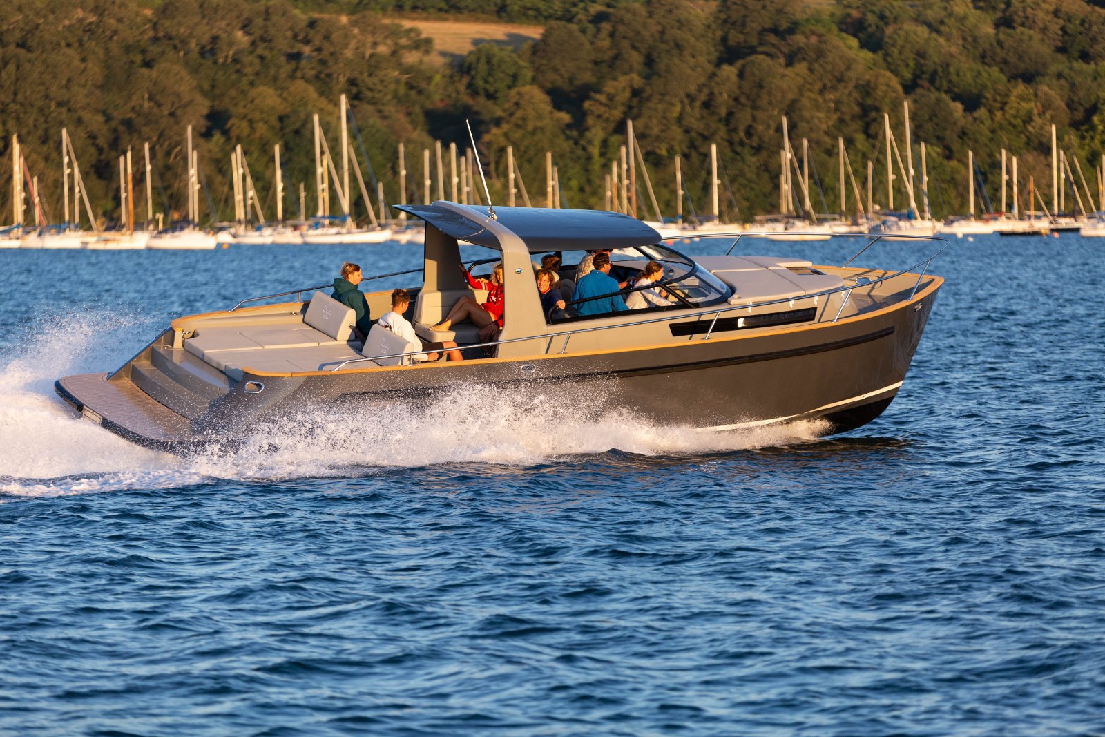 Cockwells Duchy Sport, the 11.2-metre wakesurfing day boat, on the water showing its semi-walkaround deck and radar arch